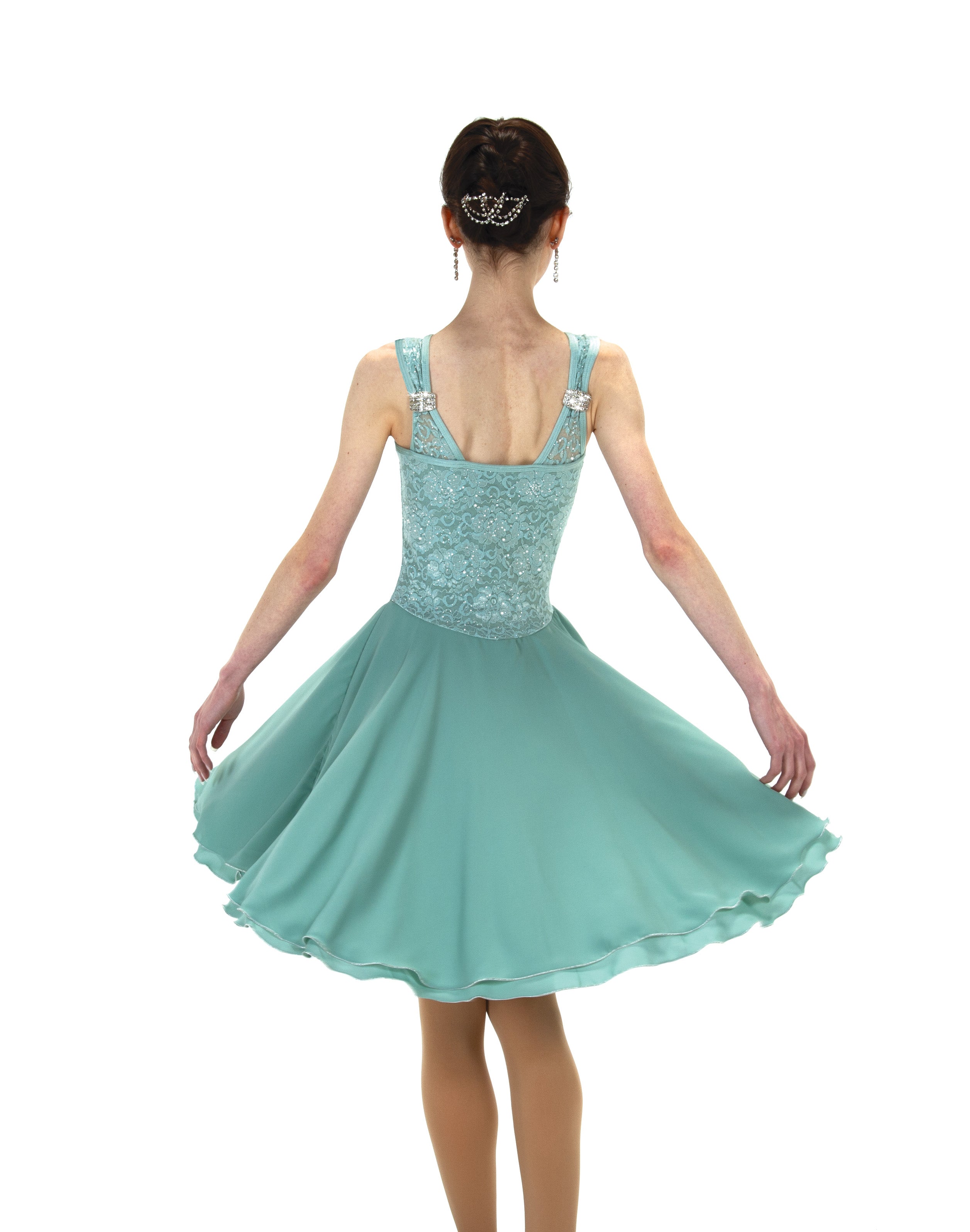 Back view of Willowy Waltz Figure Skate Dress featuring bow detail and glitter lace, designed for elegance in skating and dance routines.