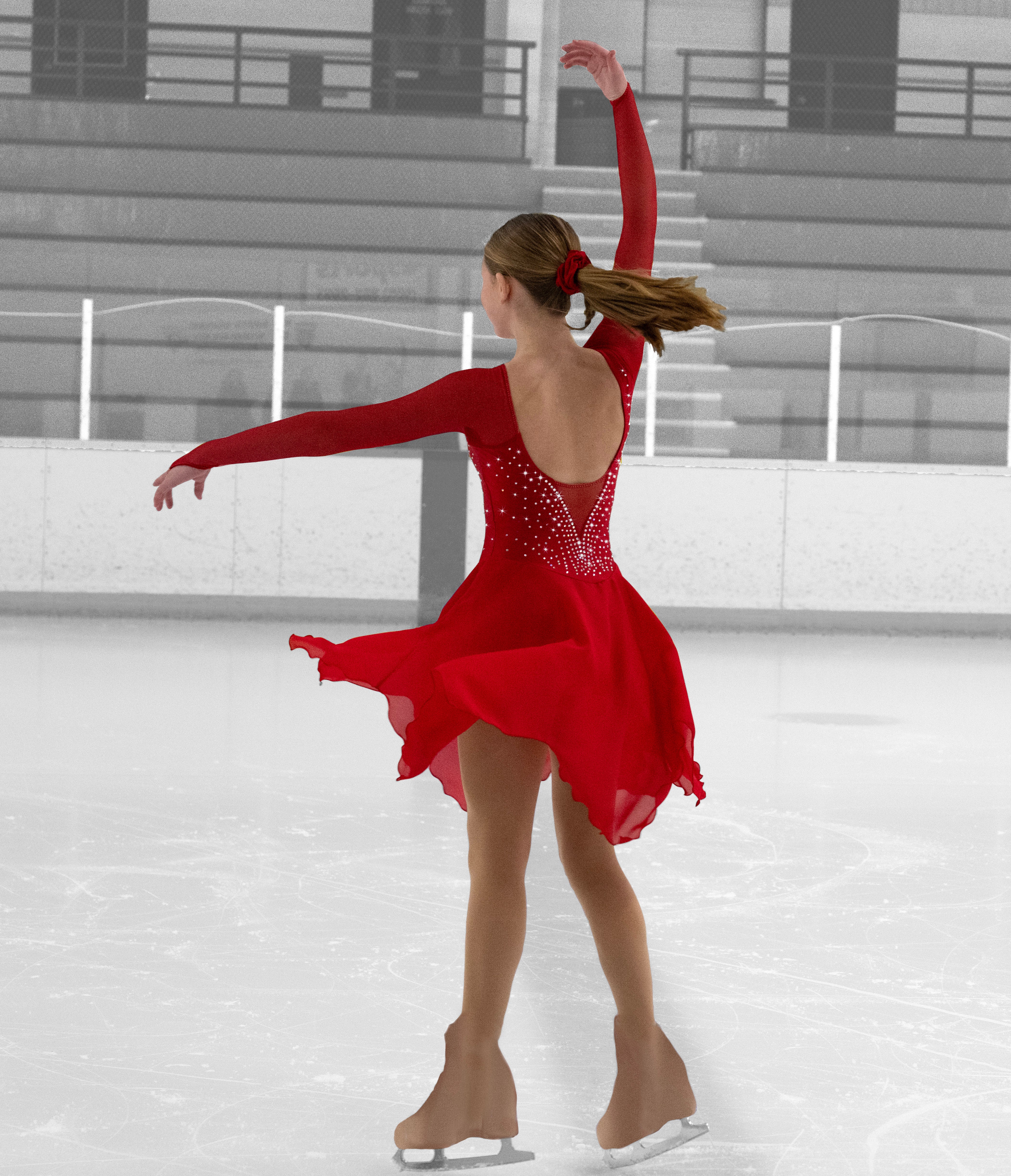 Back view of JR209 Rhinestone Skate Dress in red, featuring open back, rhinestone detailing, and flowing skirt for elegant skating routines.