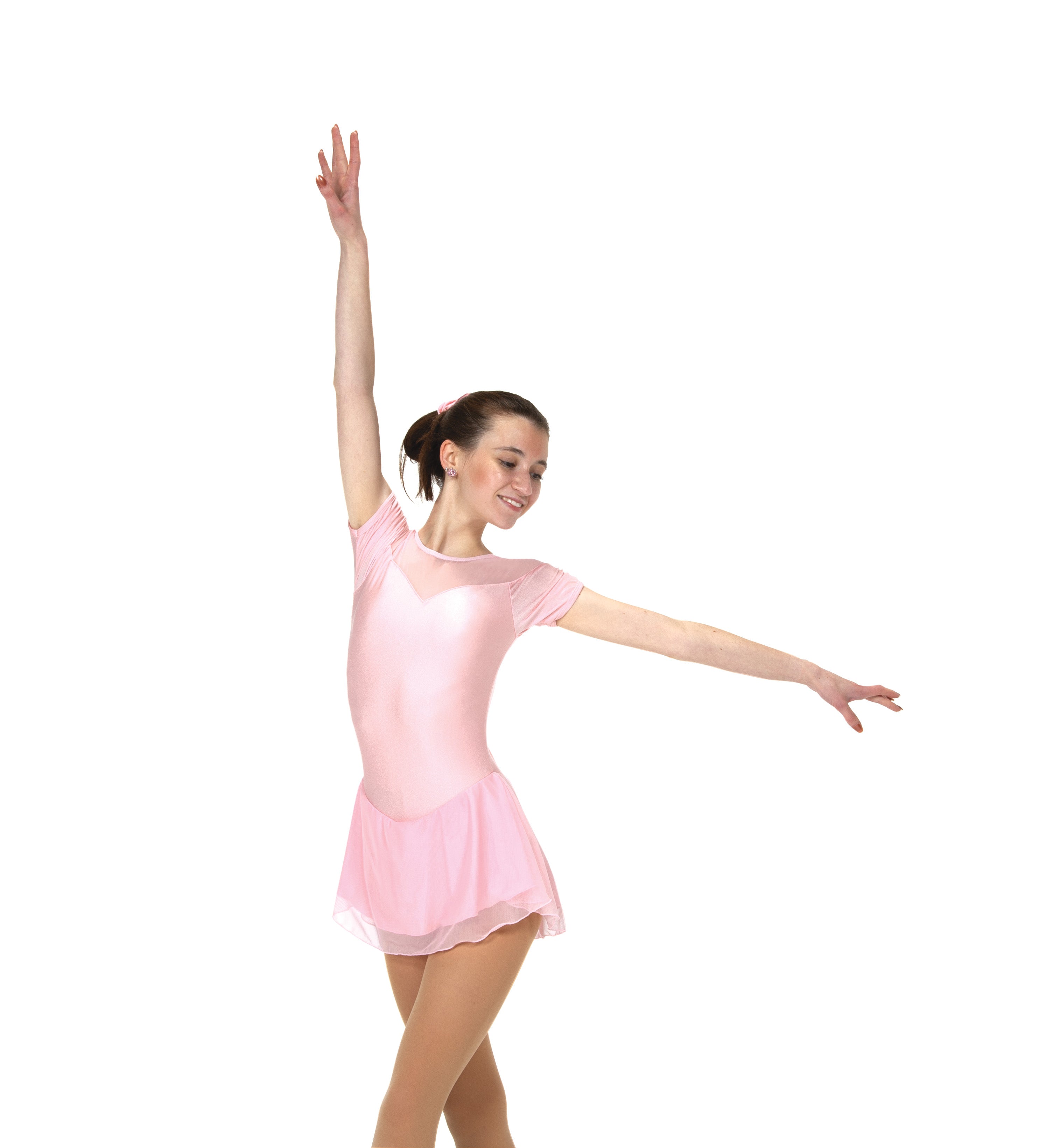 Side pose in ballet pink figure skate dress with sweetheart insert