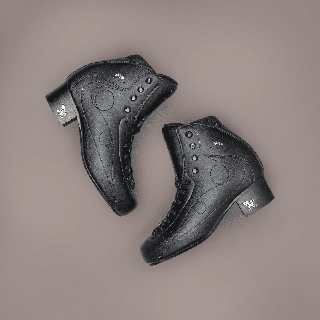 Pair of black Risport Royal Pro figure skate boots with sleek finish and ankle support, crafted for serious figure skating athletes.