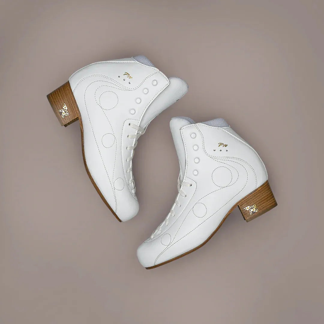 Pair of white Risport Royal Pro figure skate boots with wooden heels and gold accents, ideal for competitive skaters.