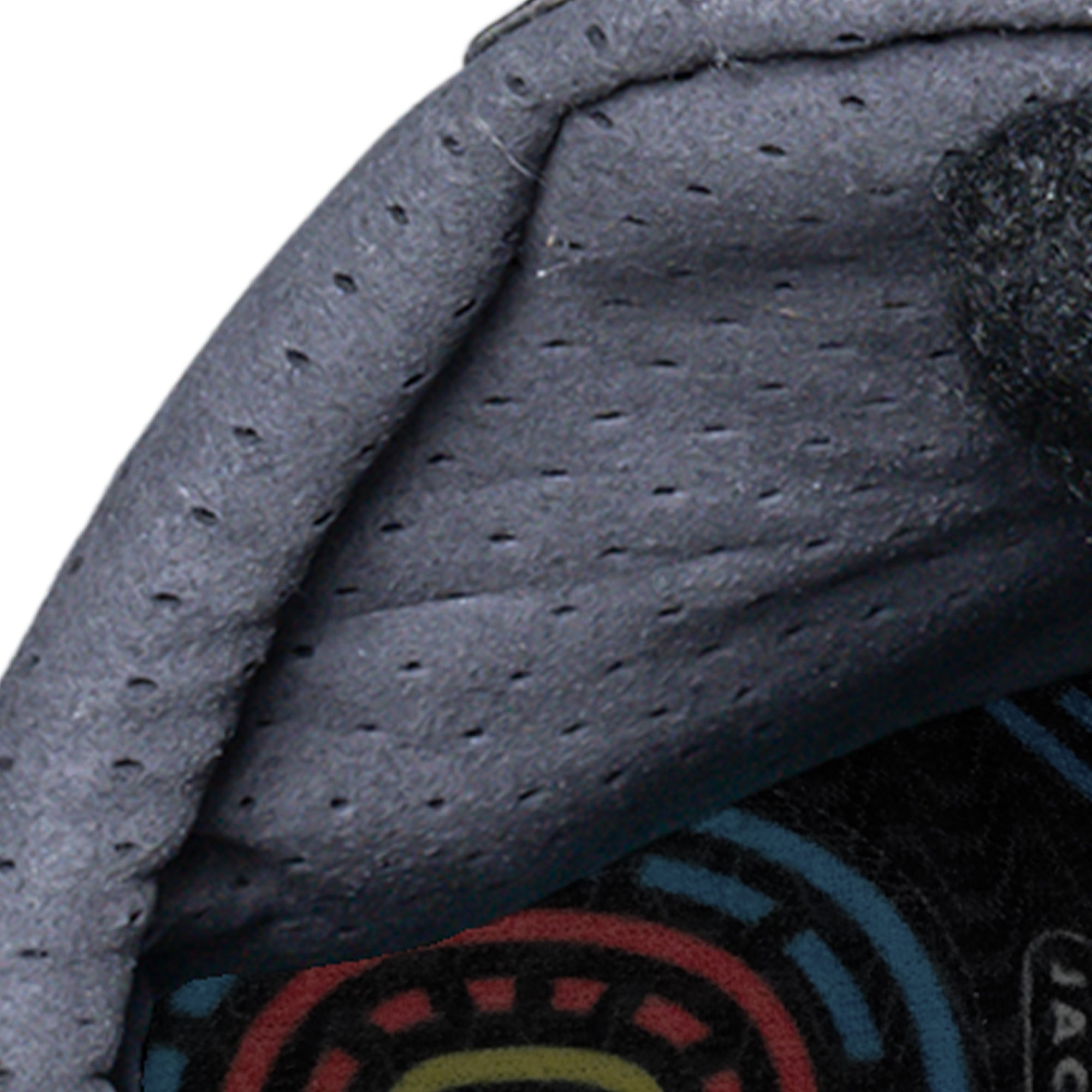 Close-up of inner lining in Jackson Mens Synergy Ignite PBX Figure Skate Boot featuring perforated padding and colorful insole.