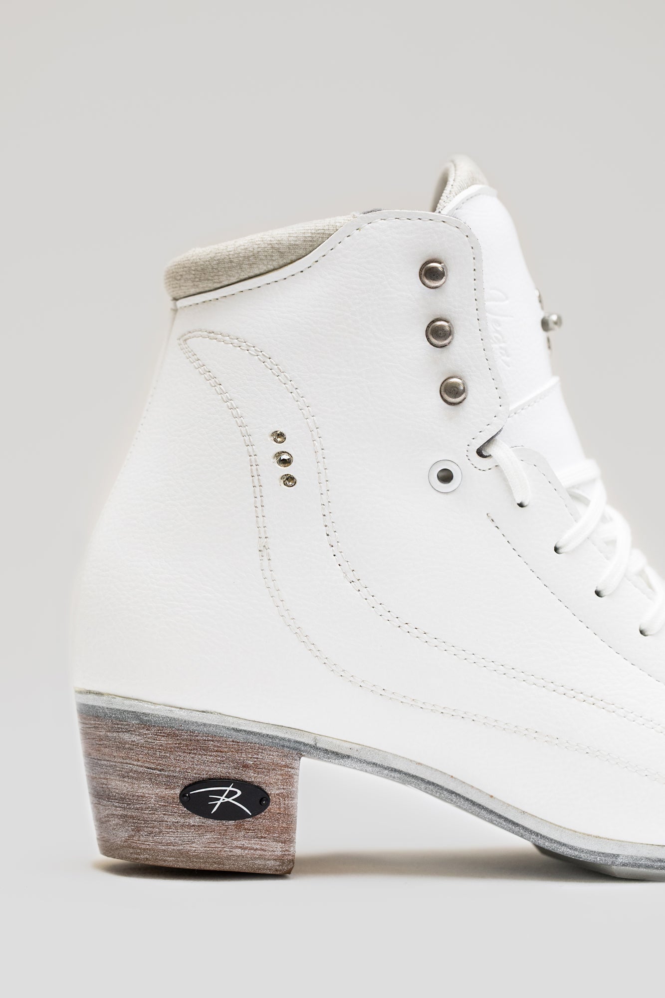 Right side view of Riedell Vega womens figure skate boot showcasing ergonomic design and reinforced stitching for elite skaters.