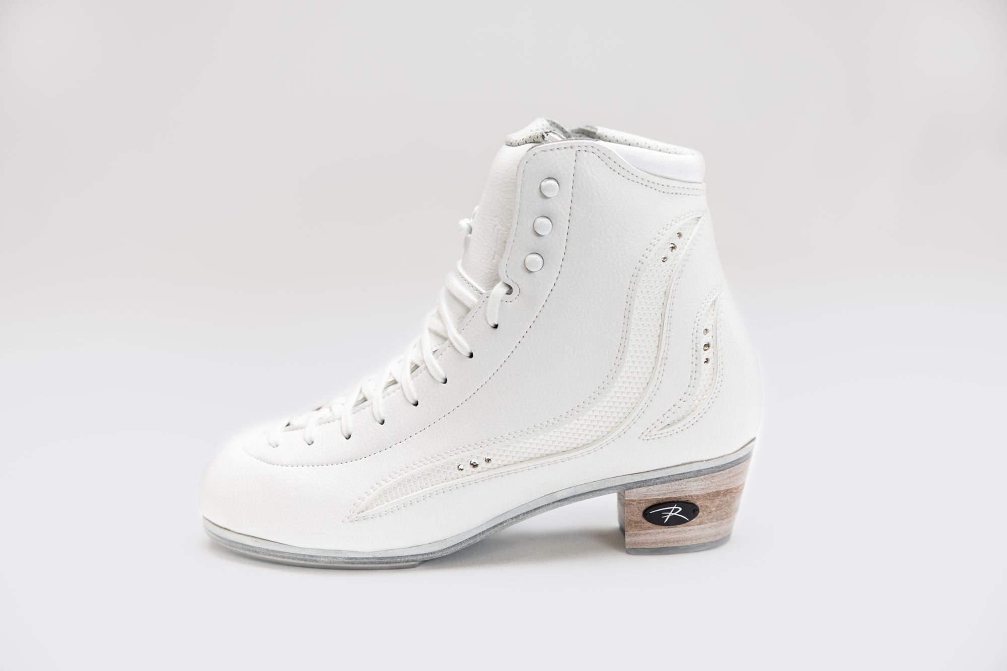 Side profile of Riedell Elara womens figure skate boots featuring elegant design and durable construction for advanced figure skating.
