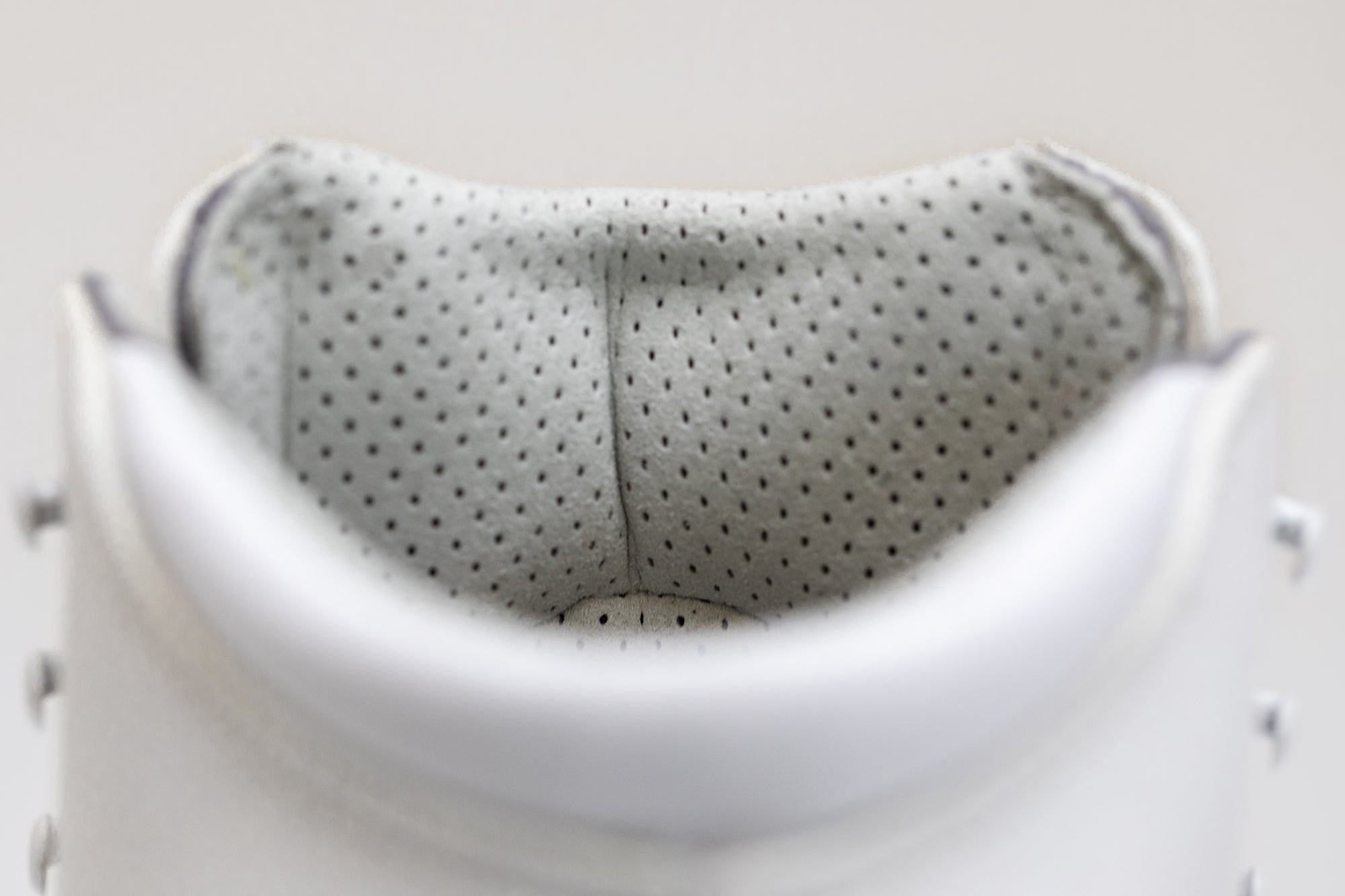 Interior collar of Riedell Elara womens figure skate boots with perforated padding for enhanced comfort and breathability.