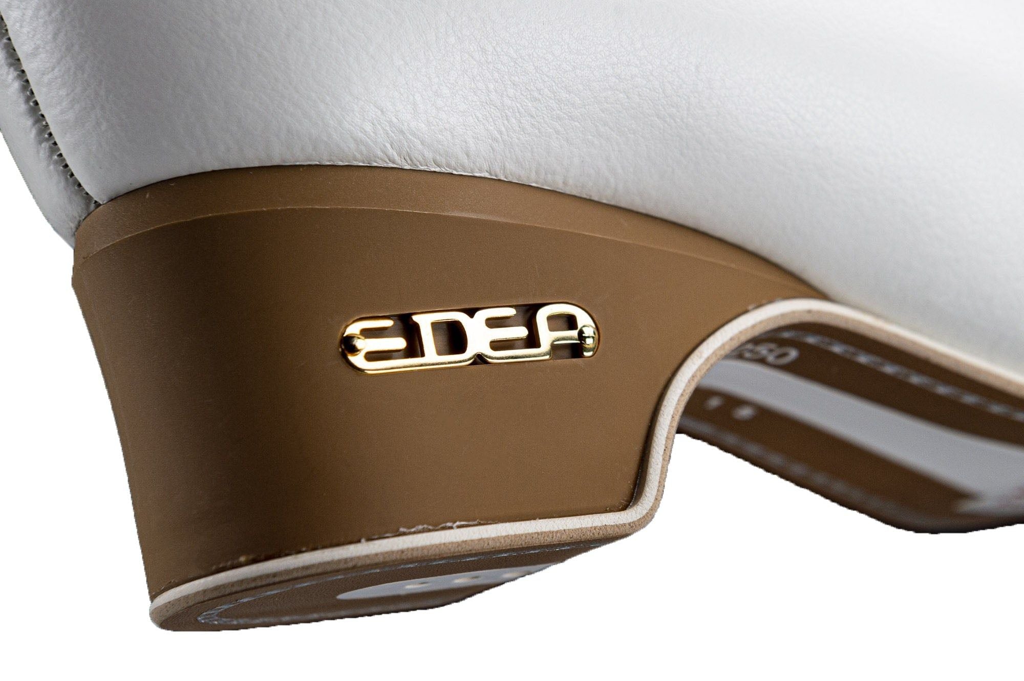 Close-up of the Edea logo on the brown heel of the Flamenco Figure Skate Boots, emphasizing stylish and durable construction.