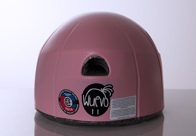 Rear view of pink Wuevo Ice Skating Helmet with certification labels and brand logo, emphasizing safety standards and Canadian quality.