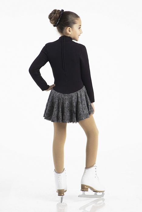 Back view of girl in Mondor Polartec skate dress with skates